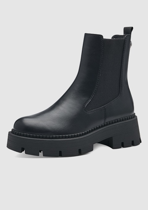 Schwarze Chelsea-Stiefel mit dicker Gummisohle.