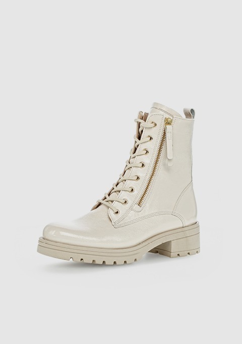 Beige Stiefel mit Schnürung und seitlichem Reißverschluss. Beige Stiefel mit Schnürung und seitlichem Reißverschluss.
