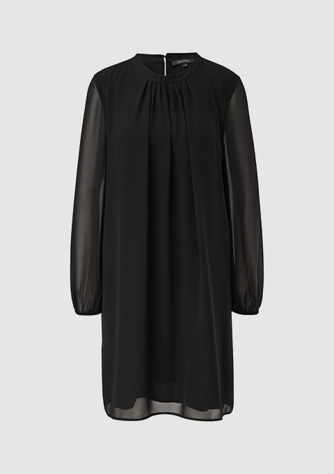 Ein schwarzes Kleid mit langen, transparenten Ärmeln und einem runden Halsausschnitt. Ein schwarzes Kleid mit langen, transparenten Ärmeln und einem runden Halsausschnitt.