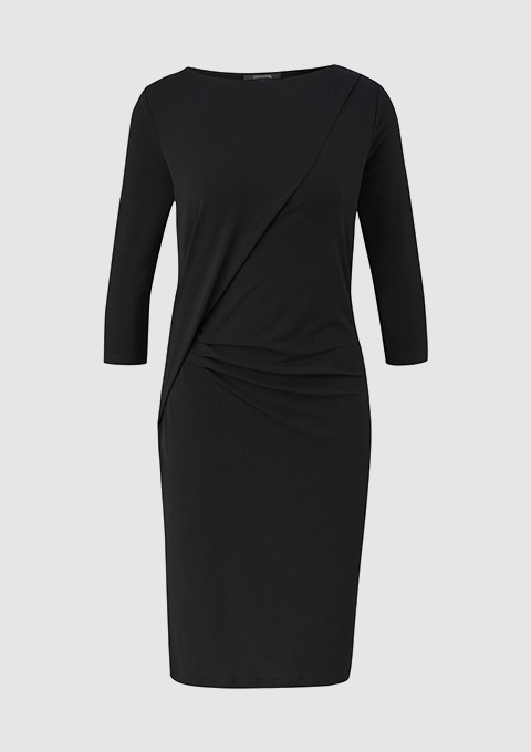 Ein schwarzes Kleid mit dreiviertel Ärmeln und seitlichem Raffungseffekt. Ein schwarzes Kleid mit dreiviertel Ärmeln und seitlichem Raffungseffekt.