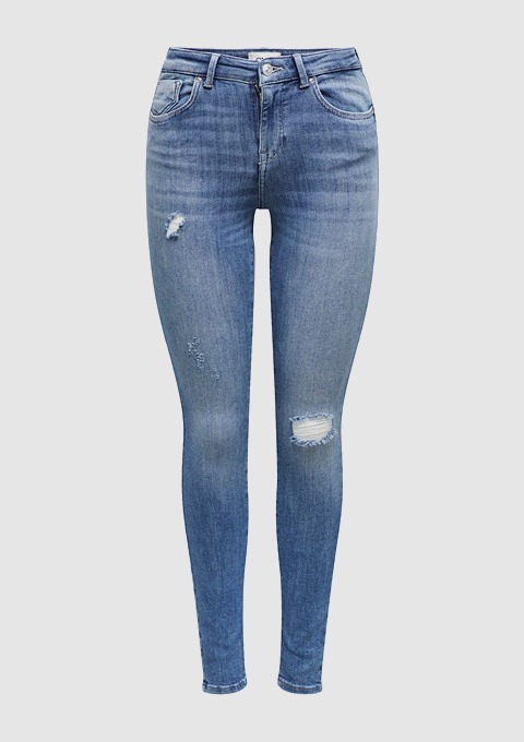 Ein Paar blaue Jeans mit Rissen und im Skinny-Fit-Stil.