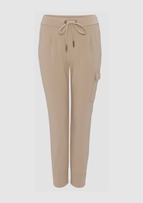 Beige Jogginghose mit Kordelzug und Seitentasche. Beige Jogginghose mit Kordelzug und Seitentasche.