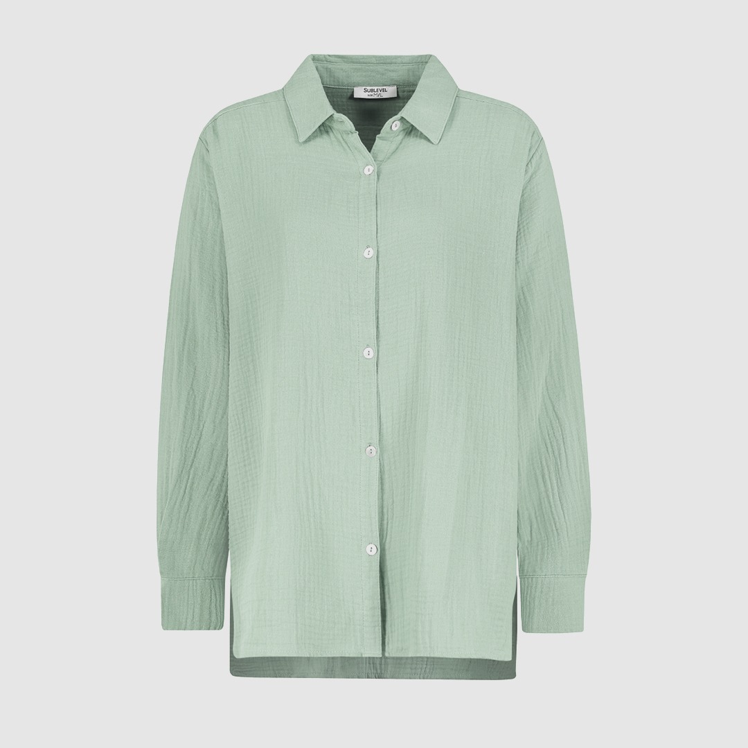 Eine hellgrüne, langärmlige Bluse mit Kragen und Knöpfen. Eine hellgrüne, langärmlige Bluse mit Kragen und Knöpfen.