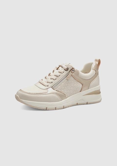 Beige Sneakers mit Reißverschluss und perforiertem Design. Beige Sneakers mit Reißverschluss und perforiertem Design.