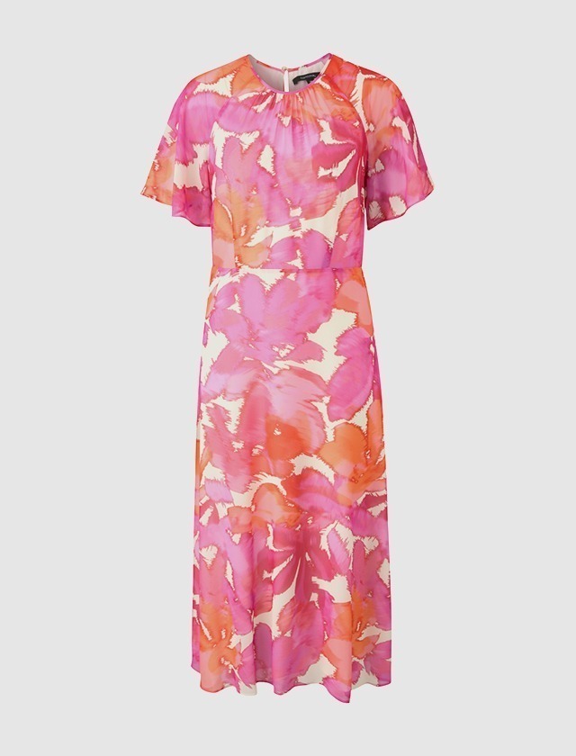 Ein farbenfrohes, blumenmusterndes Kleid in Rosa- und Rottönen mit kurzen Ärmeln. Ein farbenfrohes, blumenmusterndes Kleid in Rosa- und Rottönen mit kurzen Ärmeln.