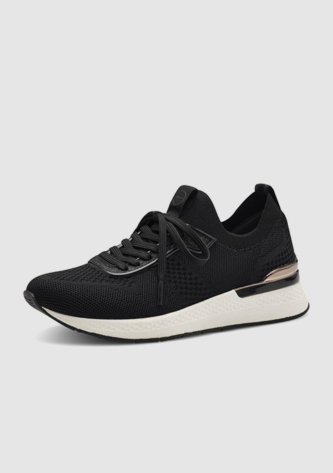 Schwarze Sportschuhe mit einem weißen Sohlenrand.