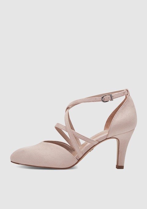 Beige Pumps mit Kreuzriemen und schmalem Absatz.