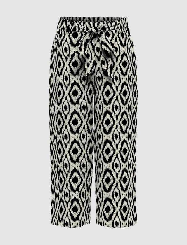 Schwarz-weiße, gemusterte Hose mit Kordelzug in der Taille.