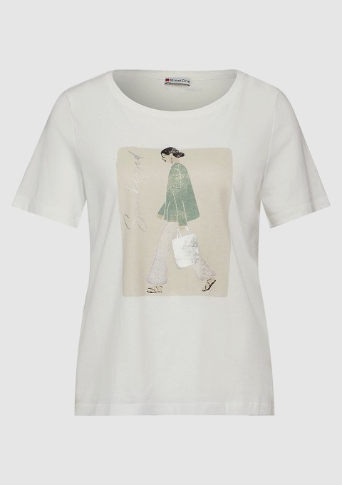 Ein weißes T-Shirt mit einer Grafik von einer Frau, die eine grüne Jacke trägt und eine Tasche hält.
