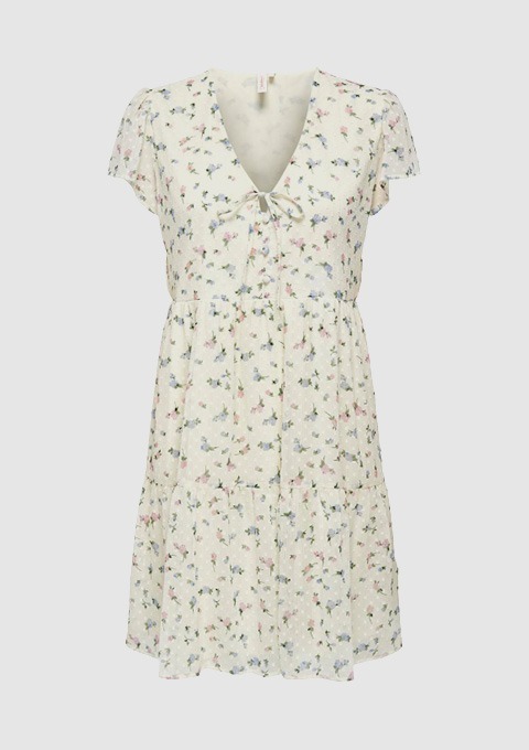 Ein kurzes, blumig gemustertes Kleid mit V-Ausschnitt und Schleife.