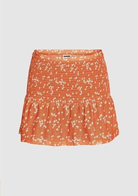 Ein orangefarbener Rock mit einem floralen Muster.