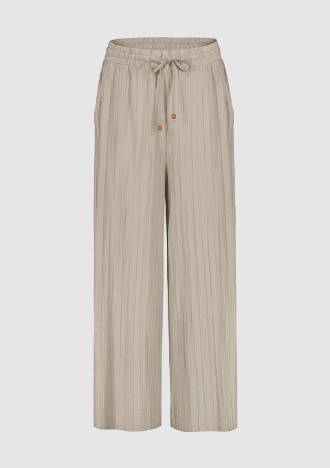 Beige, plissierte Hose mit elastischem Bund und Taschen. Beige, plissierte Hose mit elastischem Bund und Taschen.