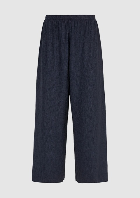 Dunkelblaue, breite Hose mit elastischem Bund. Dunkelblaue, breite Hose mit elastischem Bund.