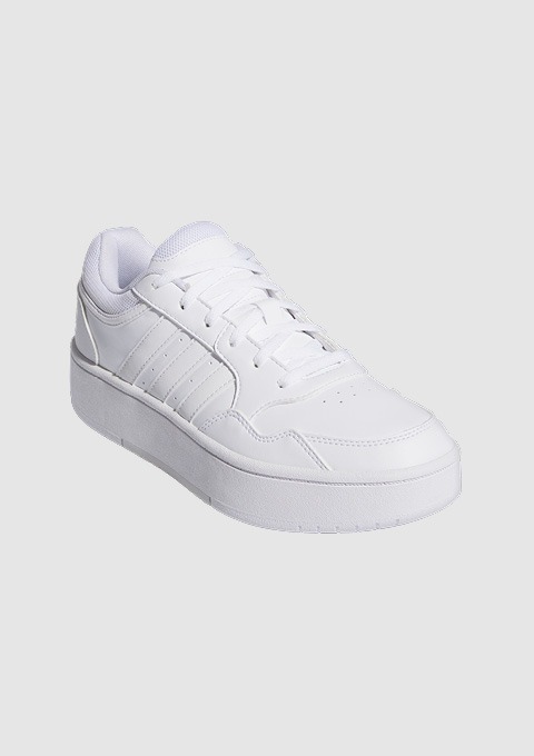 Ein weißer Sport Schuh mit einer dicken Sohle.