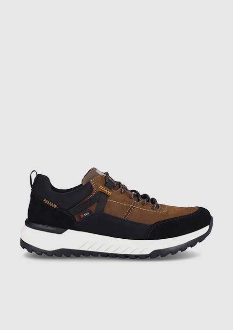 Eine seitliche Ansicht eines braunen und schwarzen Sneakers mit einer weißen Sohle.