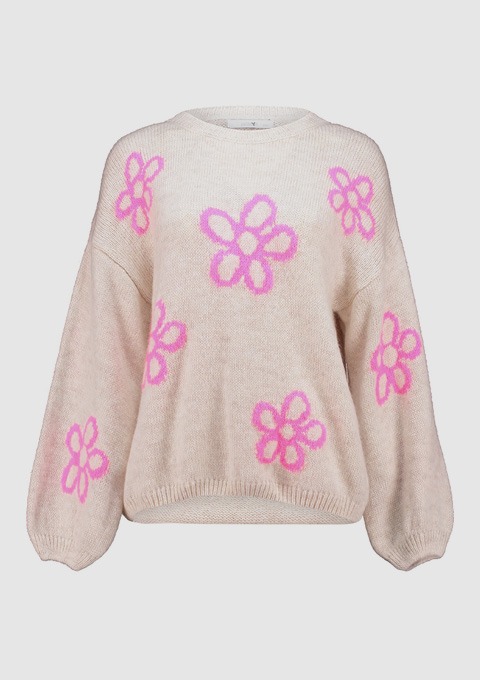 Ein beiger Pullover mit großen, pinken Blumenmotiven. Ein beiger Pullover mit großen, pinken Blumenmotiven.