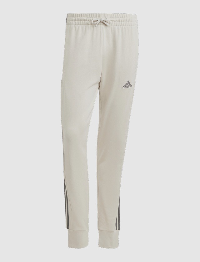 Beige Jogginghose mit elastischem Bund und Adidas-Logo. Beige Jogginghose mit elastischem Bund und Adidas-Logo.