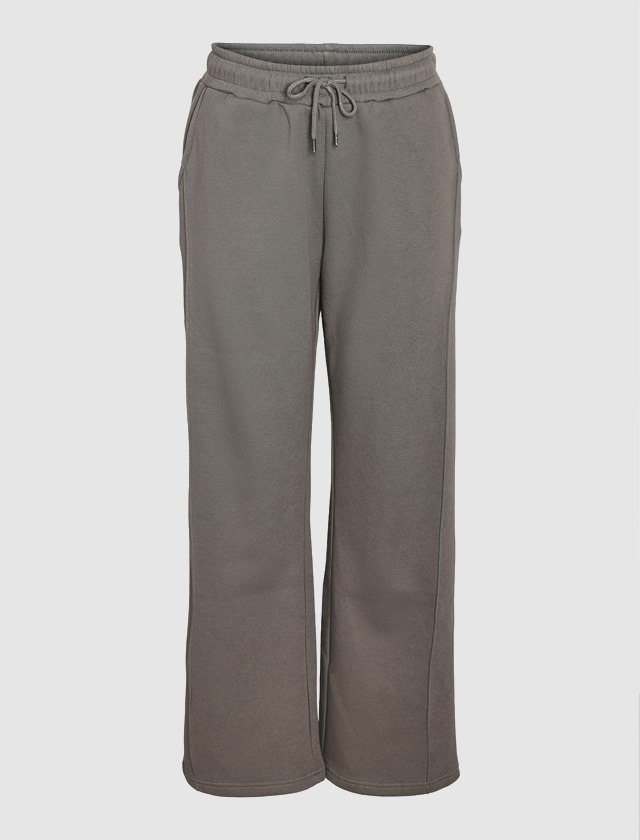 Graue, lockere Jogginghose mit elastischem Bund und Kordelzug. Graue, lockere Jogginghose mit elastischem Bund und Kordelzug.