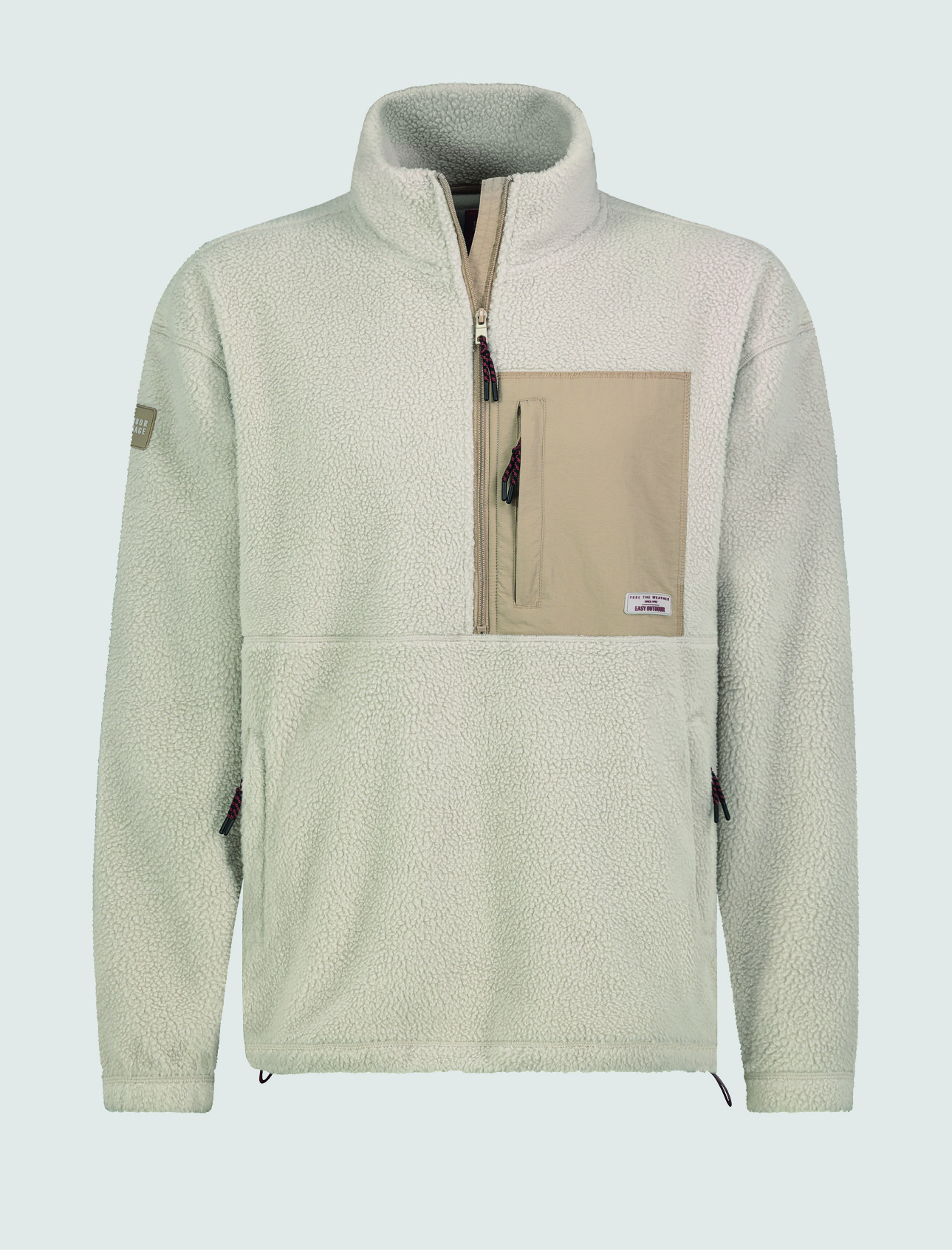 Ein heller, fleeceartiger Pullover mit einem kurzen ReiĂverschluss und einer aufgesetzten Tasche in beigefarbener Farbe. Ein heller, fleeceartiger Pullover mit einem kurzen ReiĂverschluss und einer aufgesetzten Tasche in beigefarbener Farbe.