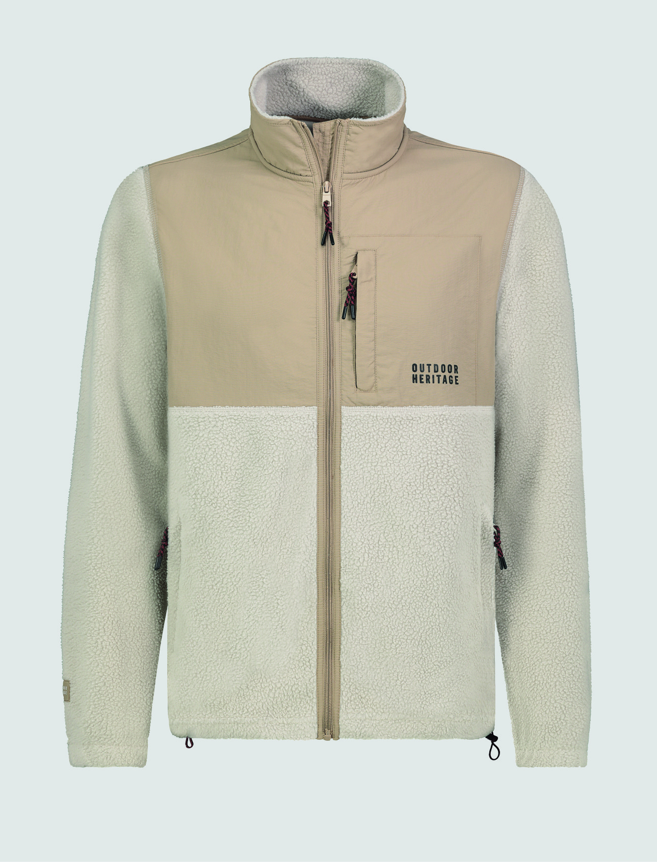 Eine beige und grĂŒne Fleecejacke mit ReiĂverschluss, Taschen und dem Schriftzug „OUTDOOR HERITAGE“. Eine beige und grĂŒne Fleecejacke mit ReiĂverschluss, Taschen und dem Schriftzug "OUTDOOR HERITAGE".