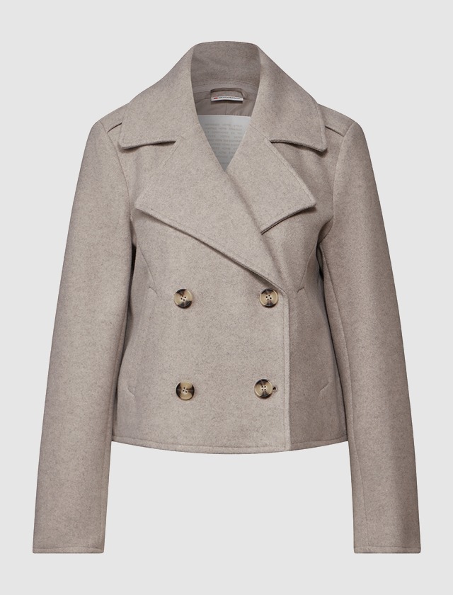 Beige Wolljacke mit Doppelreihe und großen Knöpfen. Beige Wolljacke mit Doppelreihe und großen Knöpfen.