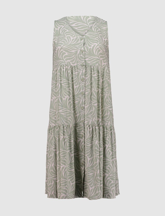 Grünes Kleid aus gemustertem Stoff, der lebendige Muster und Textur zeigt. Grünes Kleid aus gemustertem Stoff, der lebendige Muster und Textur zeigt.