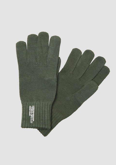 Zwei grüne Strickhandschuhe. Zwei grüne Strickhandschuhe.
